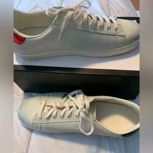 Cream shoe with green and red in it